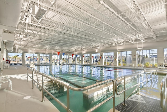 view of swimming pool featuring a water view