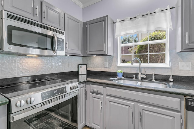 3257 Heathland Way, Mount Pleasant, SC 29466 - kitchen featuring appliances with stainless steel finishes, gray cabinets, ornamental molding, and backsplash