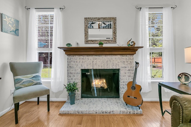 3257 Heathland Way, Mount Pleasant, SC 29466 - sitting room featuring wood finished floors, a fireplace, and healthy amount of natural light