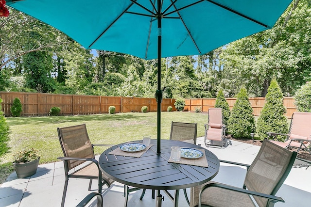 3257 Heathland Way, Mount Pleasant, SC 29466 - fenced backyard with a patio, outdoor dining space, and view of scattered trees
