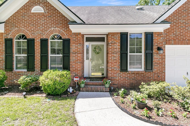 3257 Heathland Way, Mount Pleasant, SC 29466 - view of exterior entry featuring brick siding, roof with shingles, and a garage