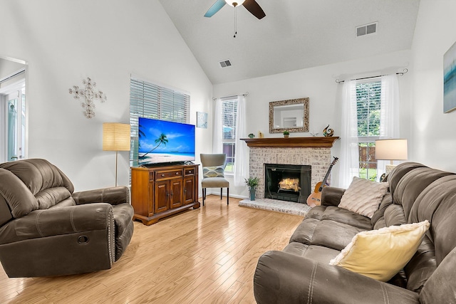 3257 Heathland Way, Mount Pleasant, SC 29466 - living room with high vaulted ceiling, light wood finished floors, a ceiling fan, and a fireplace