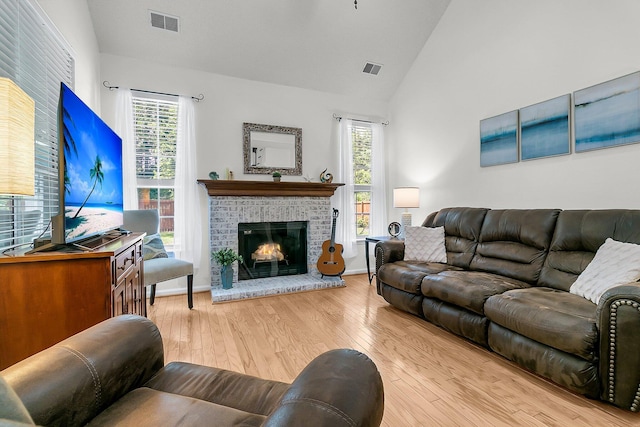 3257 Heathland Way, Mount Pleasant, SC 29466 - living room with wood-type flooring, a brick fireplace, and high vaulted ceiling