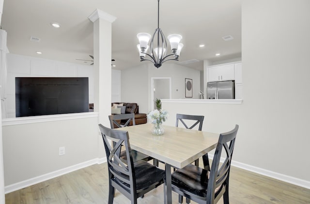 dining area with ceiling fan and light wood-type flooring