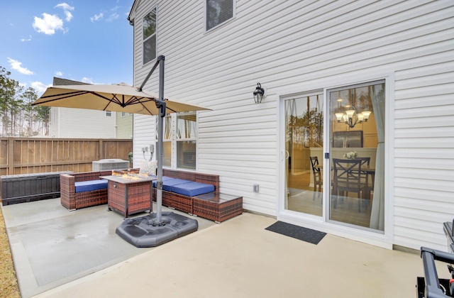 view of patio / terrace featuring an outdoor living space with a fire pit