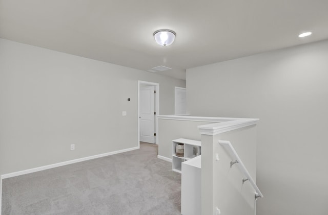 empty room featuring light colored carpet