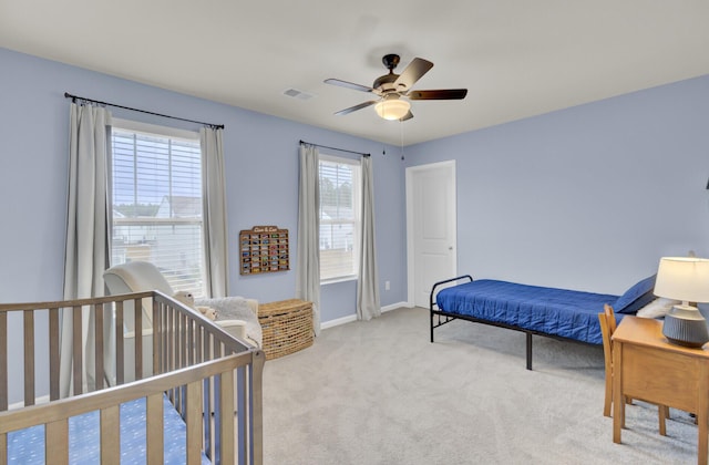 carpeted bedroom with ceiling fan