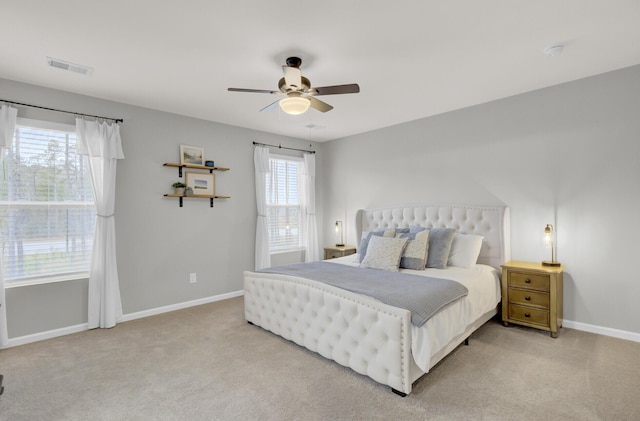 bedroom with light colored carpet and ceiling fan