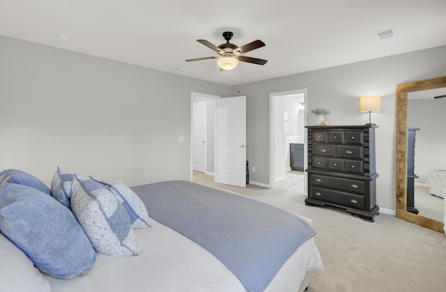 carpeted bedroom with ceiling fan and ensuite bathroom