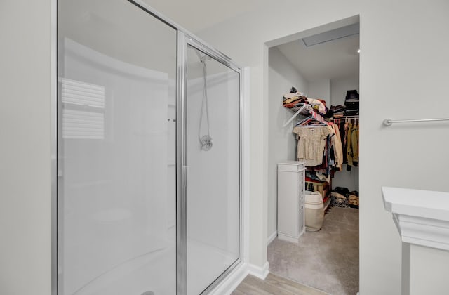 bathroom with a shower with shower door