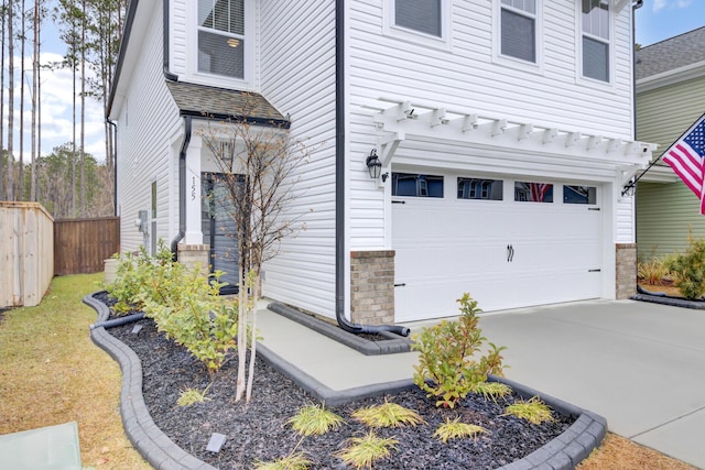 view of side of home with a garage