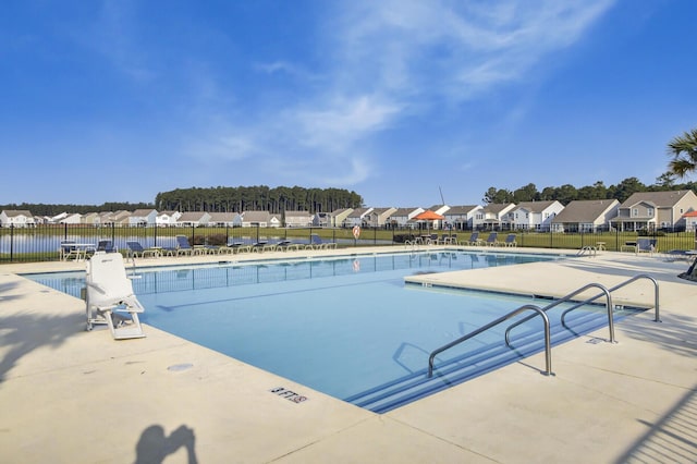 view of swimming pool featuring a patio area