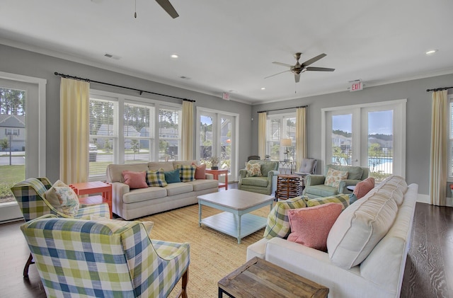 living room with crown molding, light hardwood / wood-style flooring, french doors, and ceiling fan