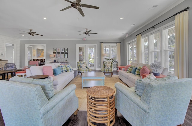 living room with ornamental molding and dark hardwood / wood-style floors