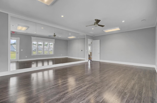 unfurnished room with crown molding, dark hardwood / wood-style floors, and ceiling fan