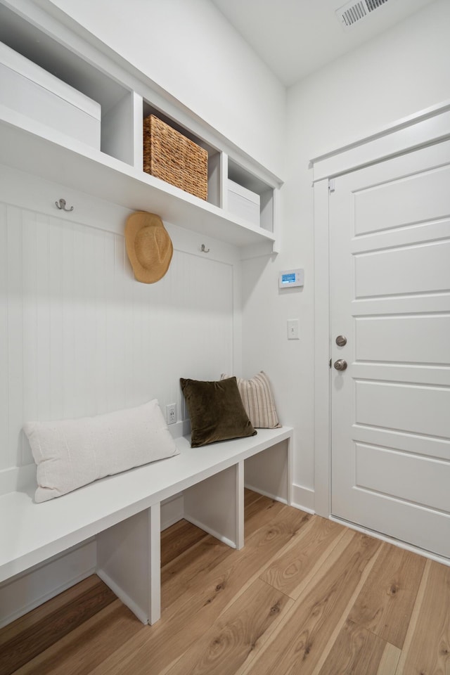 mudroom featuring visible vents and light wood finished floors