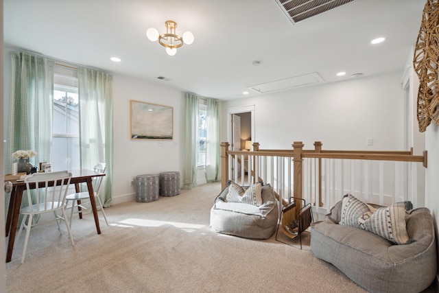 living area with visible vents, recessed lighting, attic access, and carpet flooring