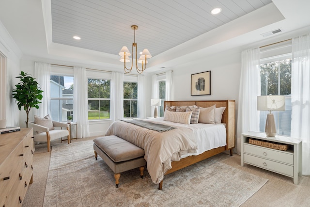 bedroom featuring visible vents, a raised ceiling, a notable chandelier, and wooden ceiling