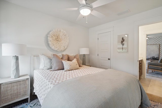 tiled bedroom featuring a ceiling fan and visible vents