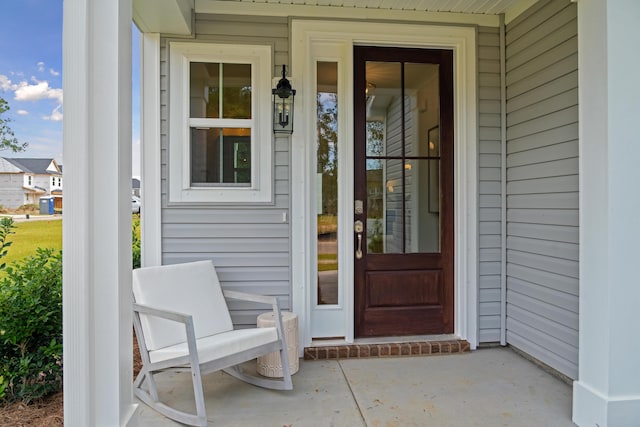 doorway to property with covered porch