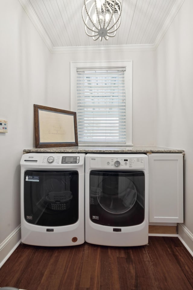 2218 Myrtle Ave, Sullivans Island, SC 29482 - laundry area with cabinet space, washer and dryer, a chandelier, ornamental molding, and dark wood-type flooring
