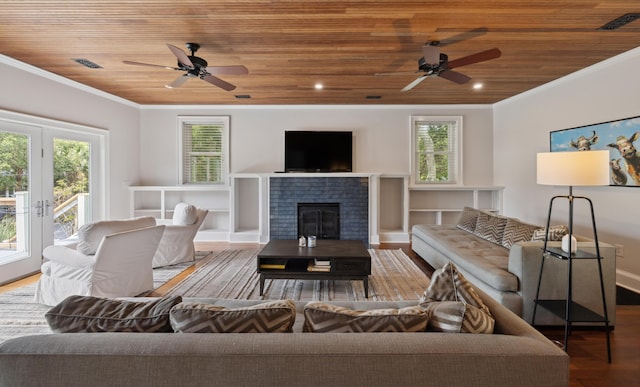 2218 Myrtle Ave, Sullivans Island, SC 29482 - living room featuring ceiling fan, wooden ceiling, wood finished floors, crown molding, and a glass covered fireplace