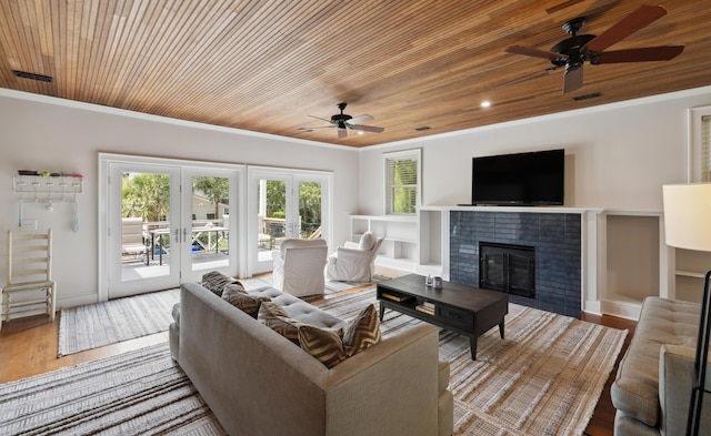 2218 Myrtle Ave, Sullivans Island, SC 29482 - living area with ceiling fan, wooden ceiling, ornamental molding, a fireplace, and wood finished floors
