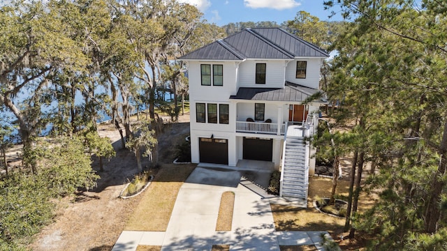 view of front of house with a garage and a porch