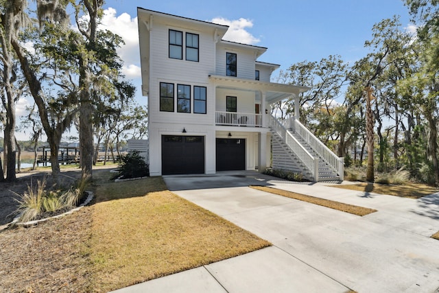 view of front facade with a garage and a porch