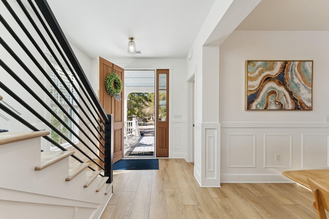 entrance foyer with light hardwood / wood-style flooring