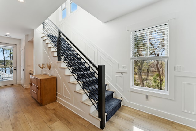 stairs with hardwood / wood-style floors