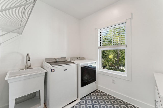 clothes washing area featuring washing machine and dryer