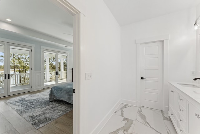 bathroom featuring french doors and vanity