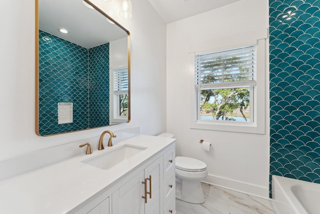 full bathroom featuring vanity, bathing tub / shower combination, and toilet