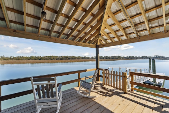 dock area with a gazebo and a water view