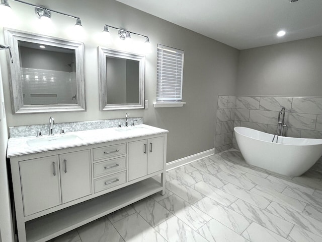 bathroom featuring vanity and a tub