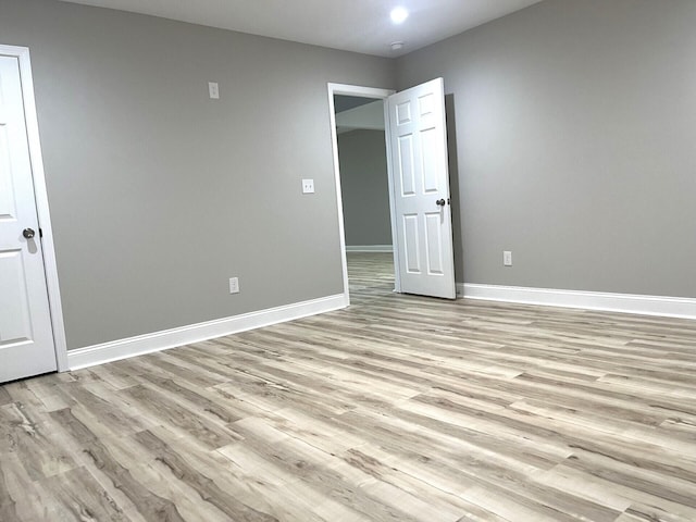 unfurnished bedroom featuring light wood-type flooring