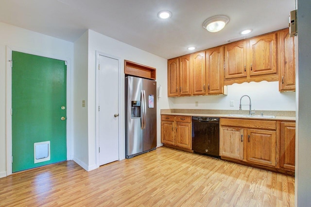 kitchen with stainless steel fridge with ice dispenser, black dishwasher, light hardwood / wood-style floors, and sink