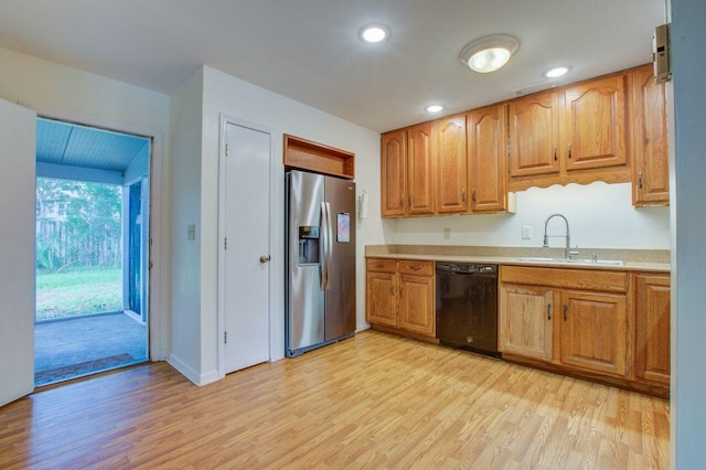 kitchen with light hardwood / wood-style floors, sink, black dishwasher, and stainless steel refrigerator with ice dispenser