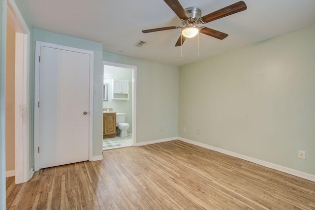 interior space with light hardwood / wood-style floors and ceiling fan