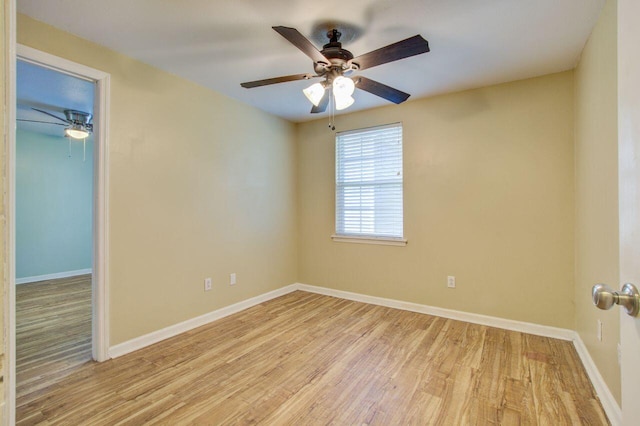 spare room featuring light hardwood / wood-style flooring and ceiling fan