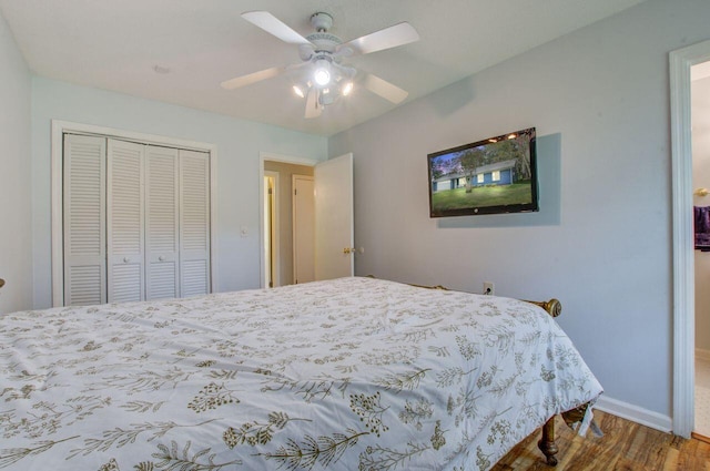 bedroom with a closet, wood-type flooring, and ceiling fan