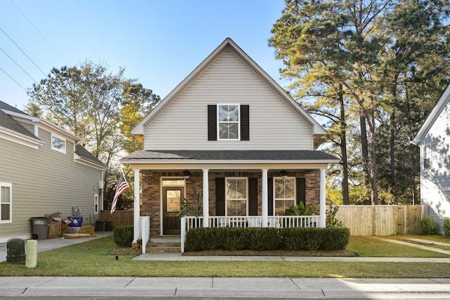 view of front of property featuring a front yard and a porch