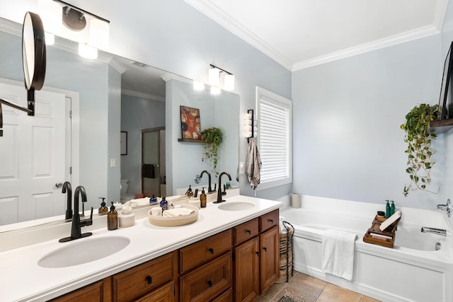 bathroom with toilet, ornamental molding, tile patterned floors, vanity, and a bathing tub