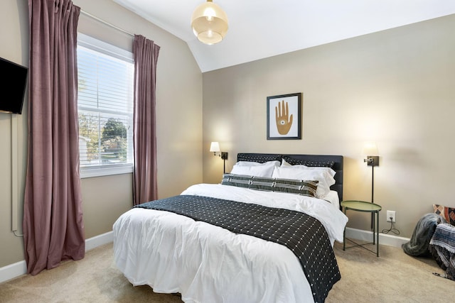 carpeted bedroom featuring vaulted ceiling