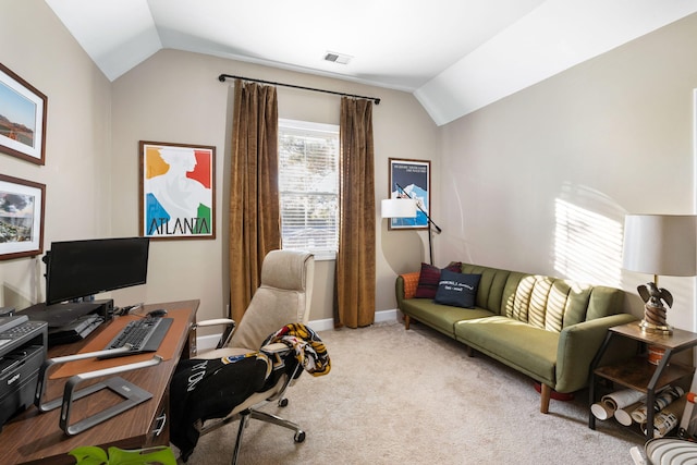 carpeted office space with lofted ceiling