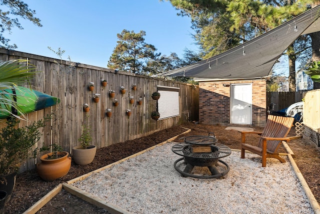 view of patio featuring a fire pit