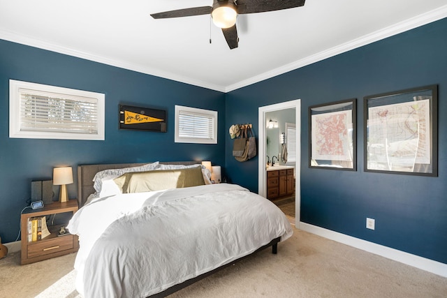 bedroom with crown molding, light carpet, sink, ceiling fan, and connected bathroom