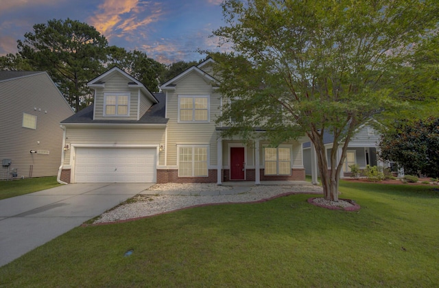 124 Sweet Alyssum Dr, Ladson, SC 29456 - traditional-style house featuring brick siding, concrete driveway, a lawn, and an attached garage