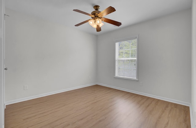 spare room featuring ceiling fan and light hardwood / wood-style floors